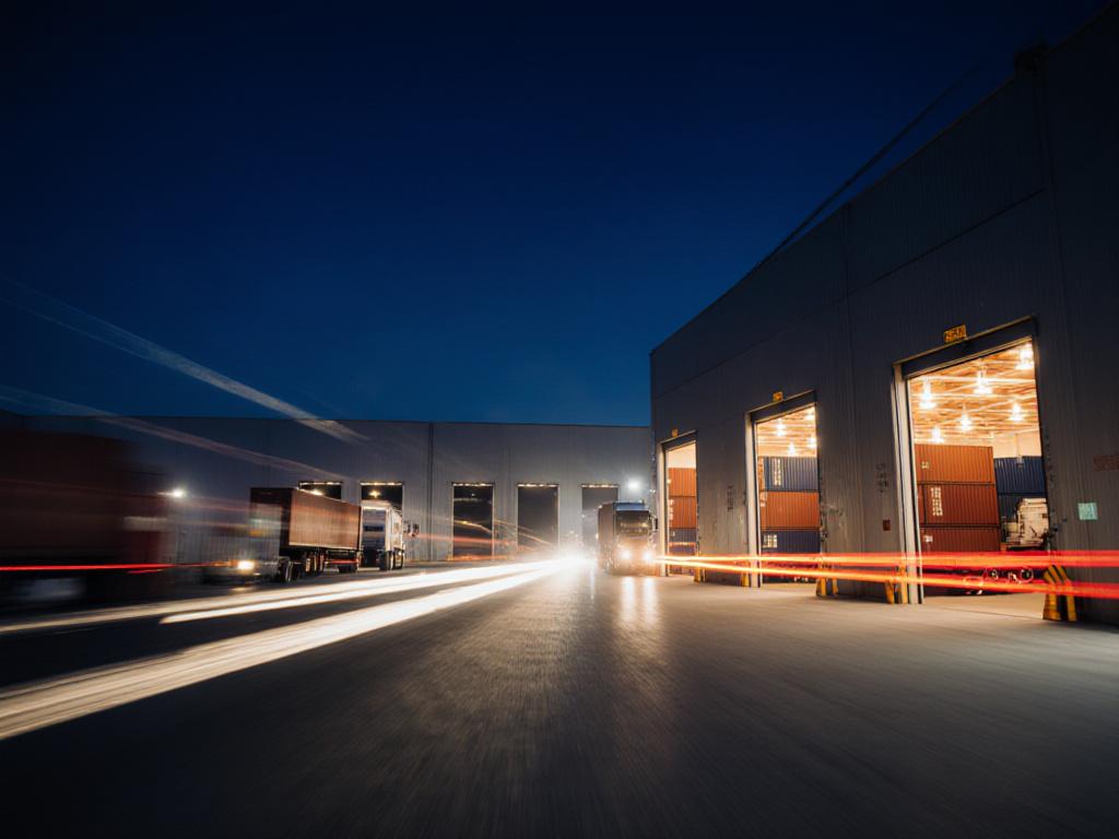 Dynamic high-exposure shot of a logistics hub at night